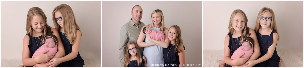newborn baby girl photographed with mom, dad, and big sisters