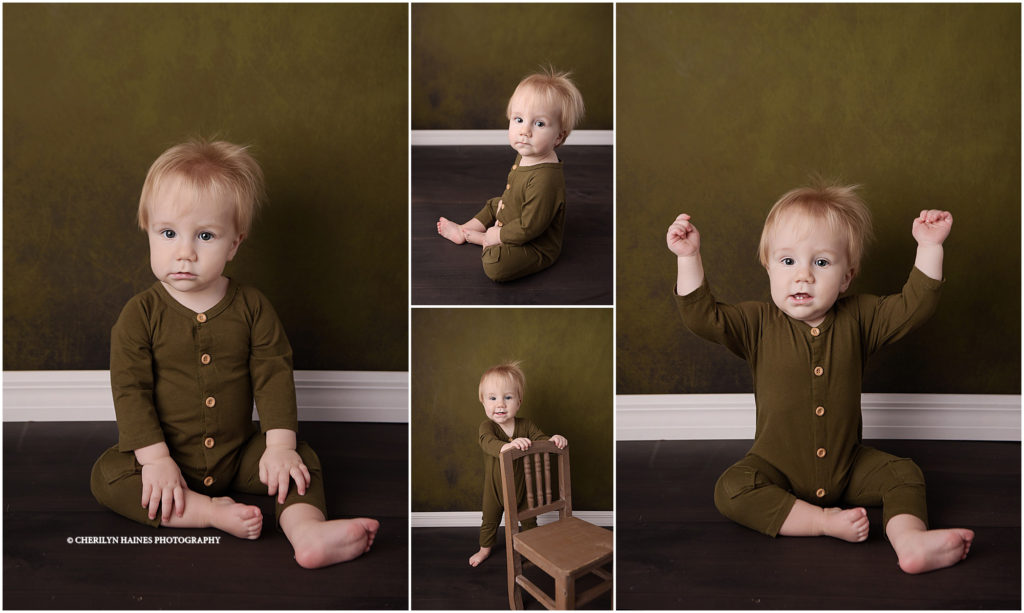 1 year old baby boy photographed in green pants romper on olive green backdrop
