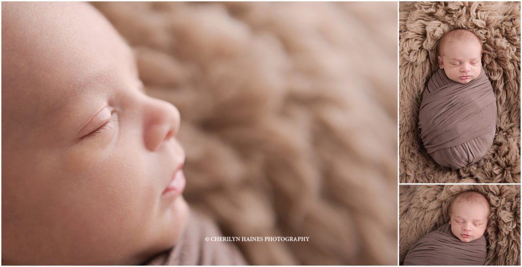 macro shots of newborn baby boy laying on tan rug