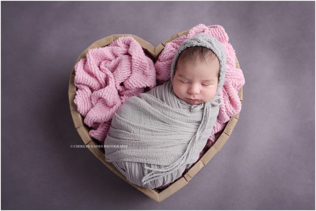 cherilyn haines photography; newborn baby girl posed in wooden heart shaped box