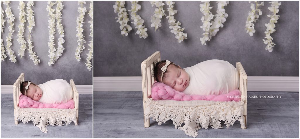 photography studio in baton rouge, louisiana; baby laying on tiny wooden bed