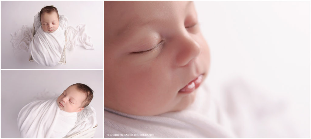 newborn photographers in baton rouge, louisiana; 23 day old baby boy swaddled in white laying in a white basket