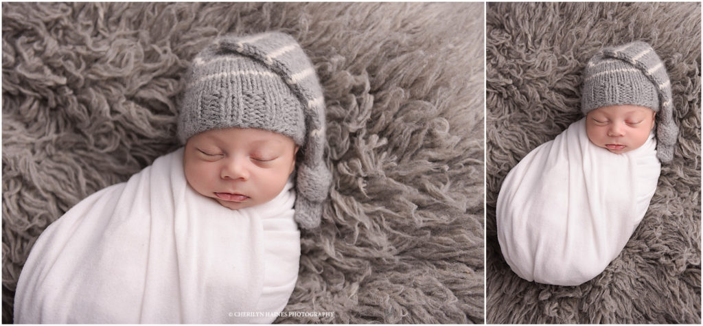newborn photographers in new orleans, louisiana; baby boy swaddled in white blanket with gray and white striped sleepy cap
