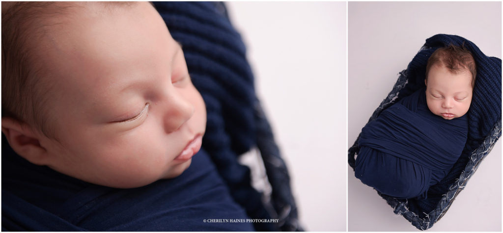 newborn photographers in denham springs, louisiana; baby boy swaddled in navy basket