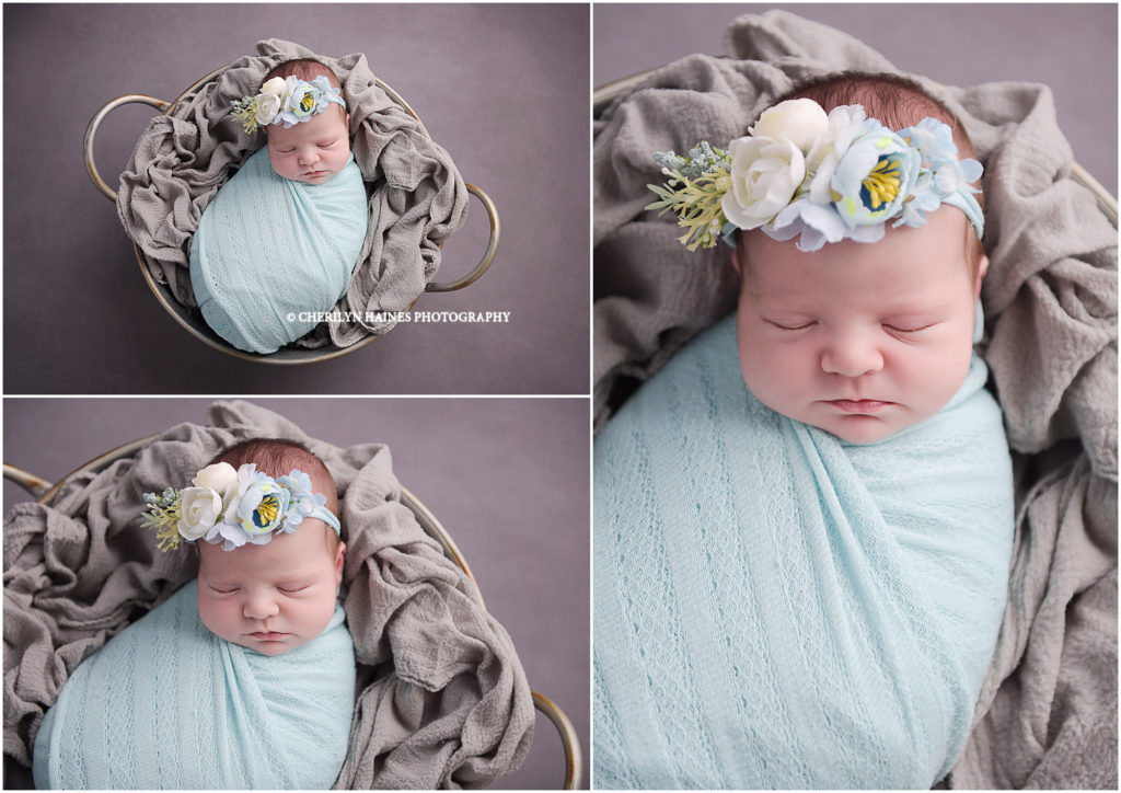 newborn photographers in baton rouge; 11 day old baby girl swaddled in aqua with aqua floral headband