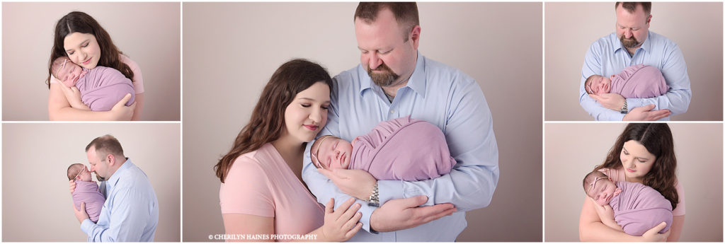 mom and dad with newborn baby girl