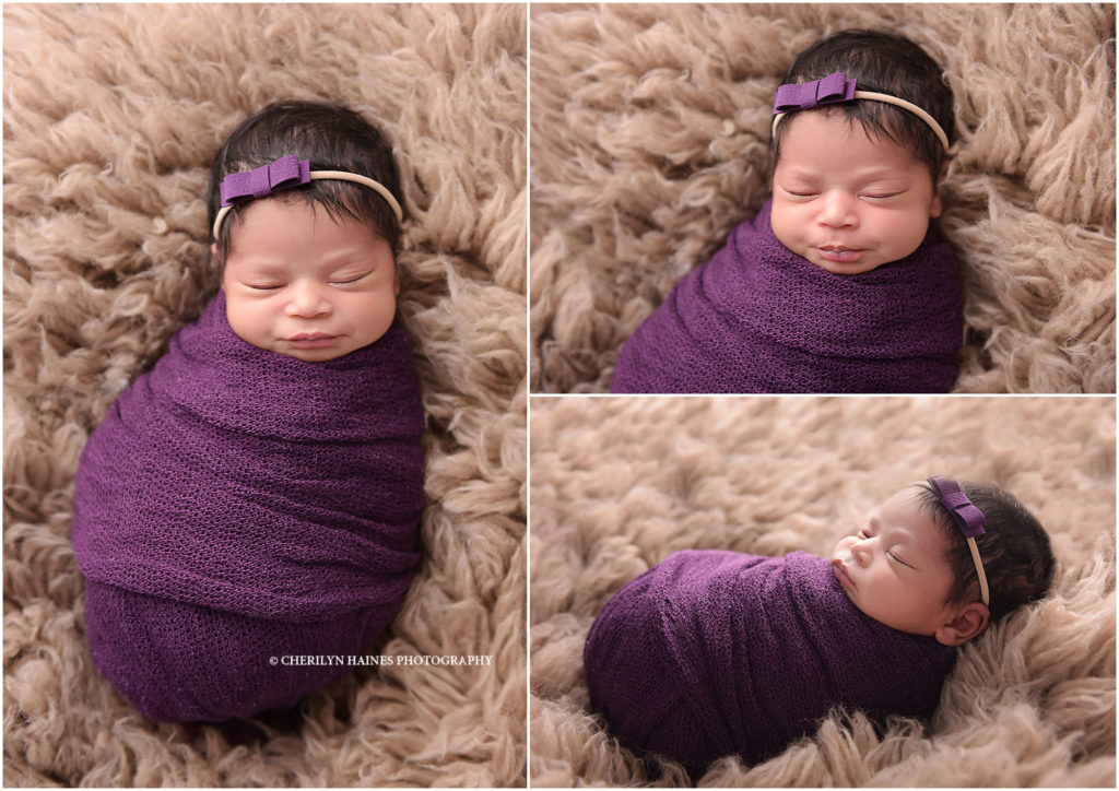 newborn photographers in baton rouge; baby girl swaddled in dark purple