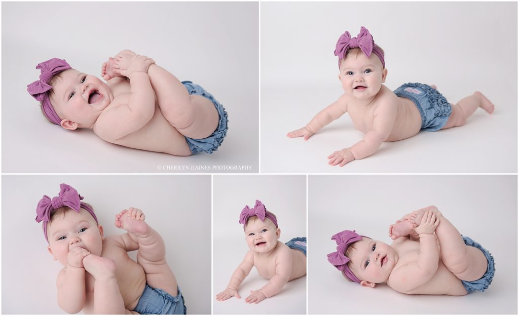 6 month portrait session of baby girl in diaper cover and purple bow