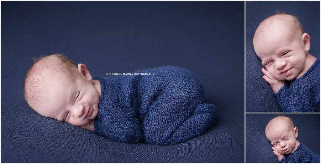newborn session with baby boy wearing navy footed romper