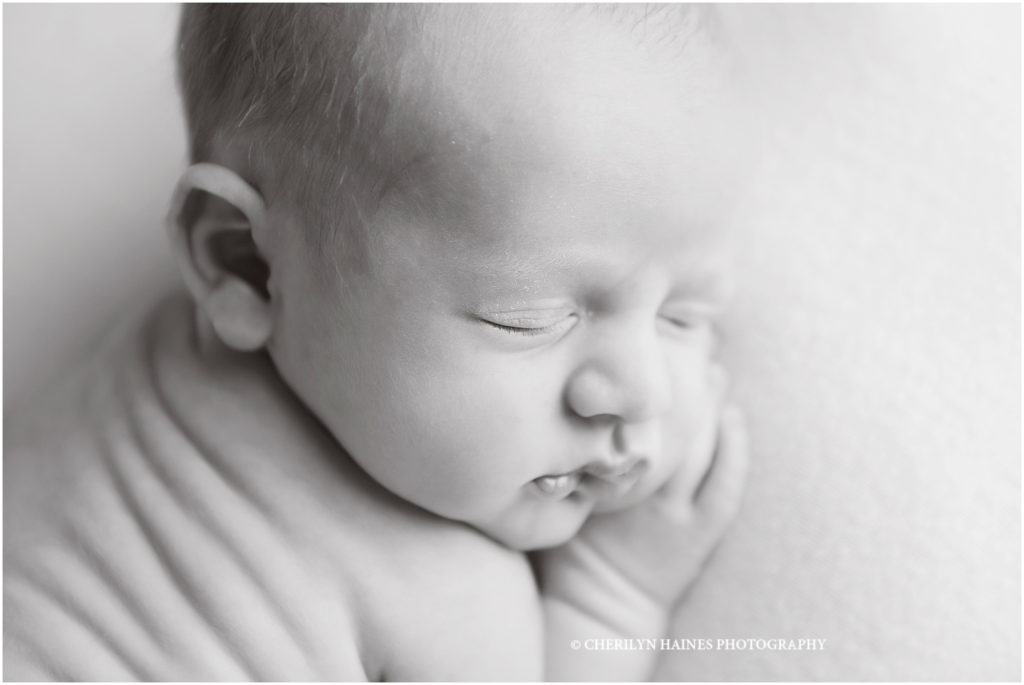 simple black and white close up newborn portrait by cherilyn haines photography