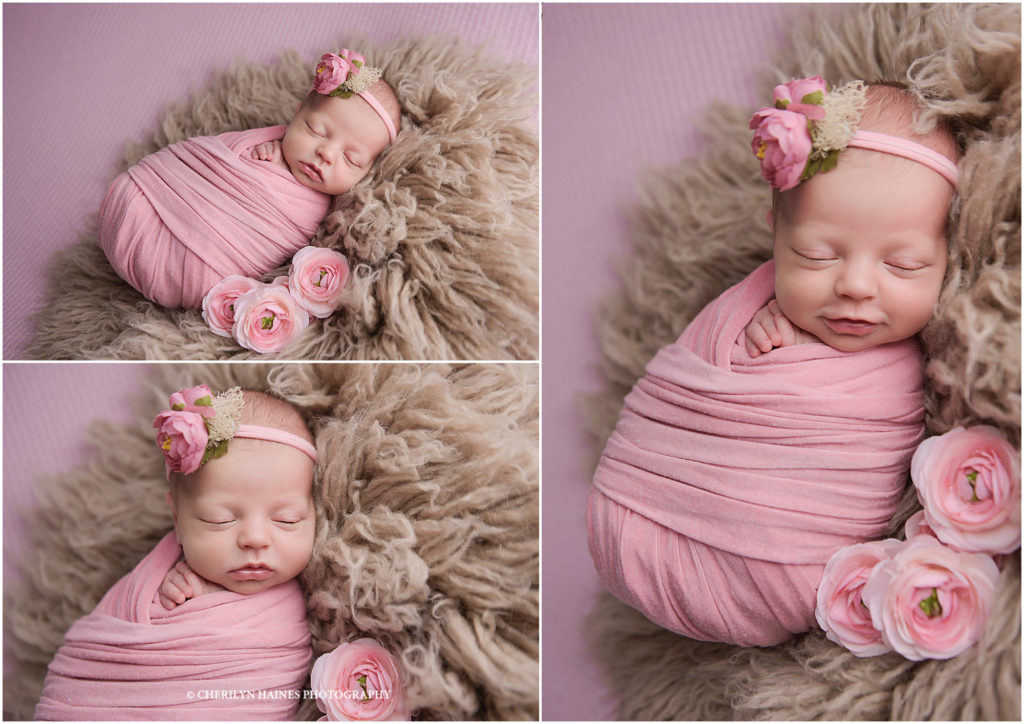 12 day old newborn baby girl photographed swaddled in pink with pink cabbage roses