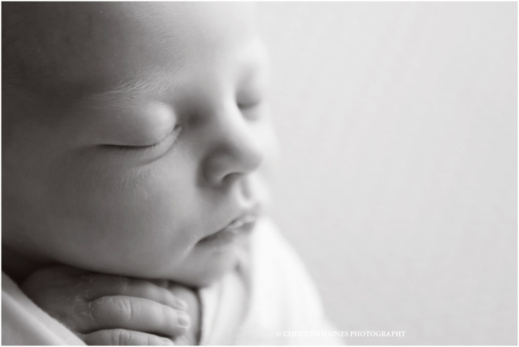 black and white close up newborn portrait taken by cherilyn haines