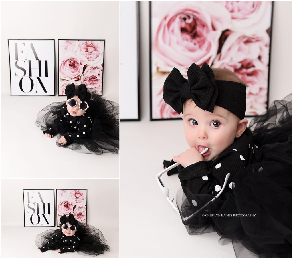 6 month portraits; baby girl wearing black and white dress with white sunglasses