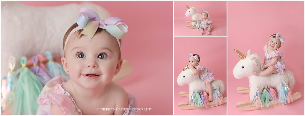 6 month old baby girl sitting on rocking unicorn